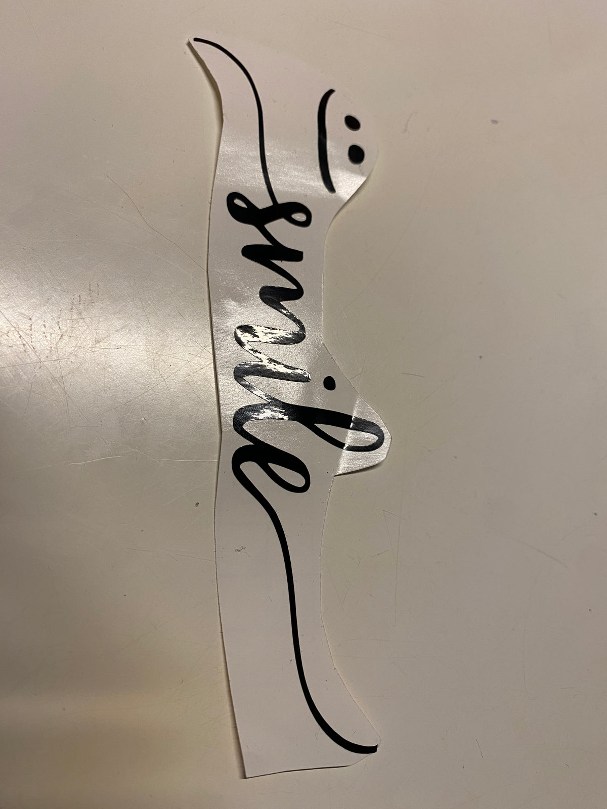 Vinyl Schriftzug „smile“ mit Smiley (3 Farben)